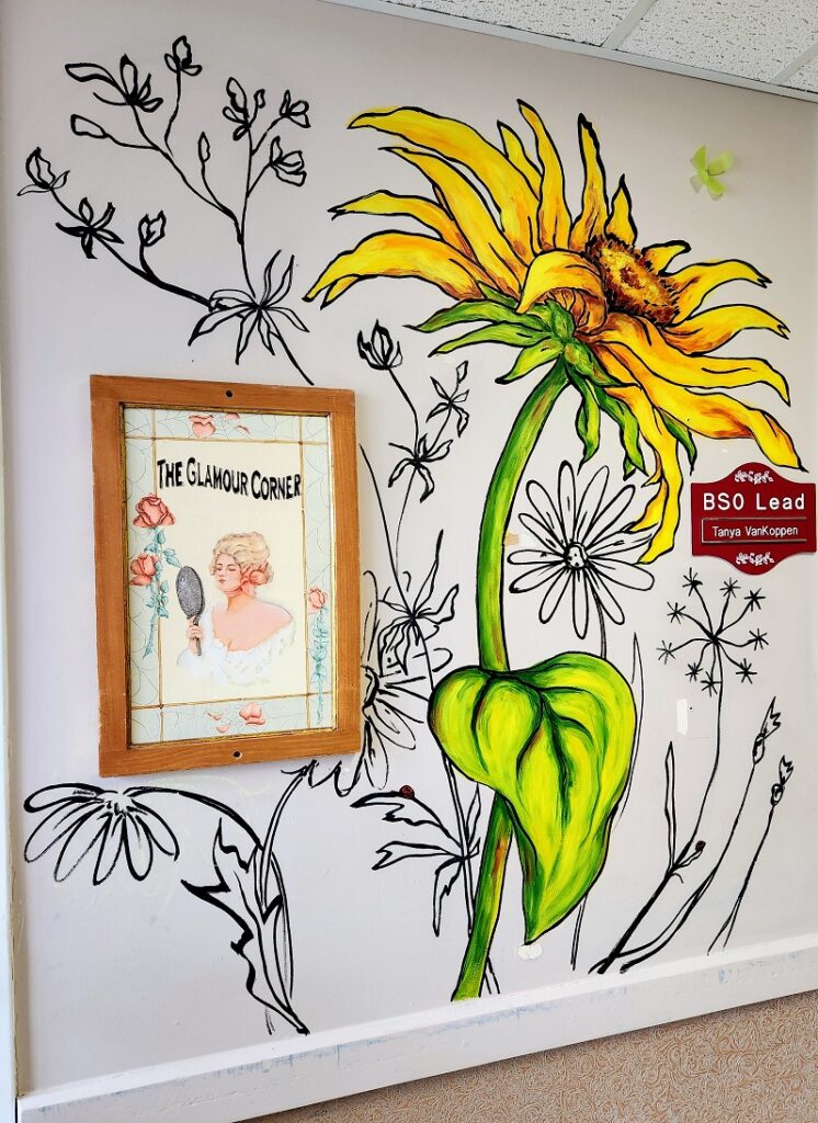 Mural of a sunflower by Sara Leger and Erynn at south glengarry long term care home.