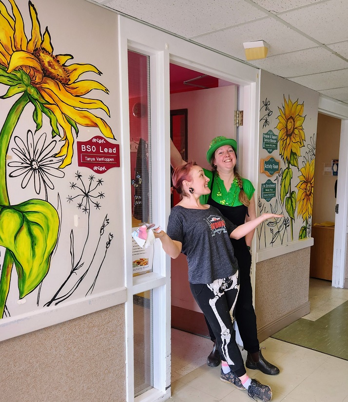 Sara Leger and Erynn in front of the mural in South Glengarry care home