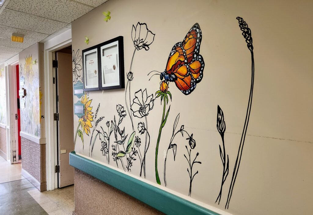 butterfly and sunflower flower wall mural by Sara Leger and Erynn, in South Glengarry