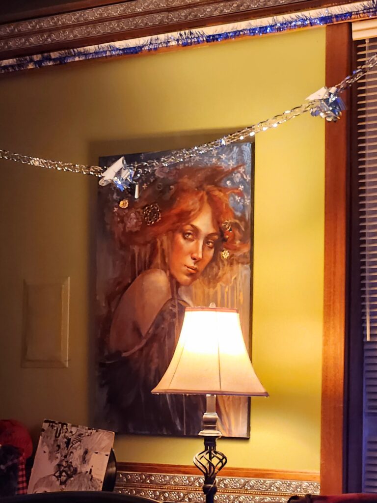 Figurative painting of a woman with long red hair looking over her shoulder, featuring large black wings that drape around her like clothing.