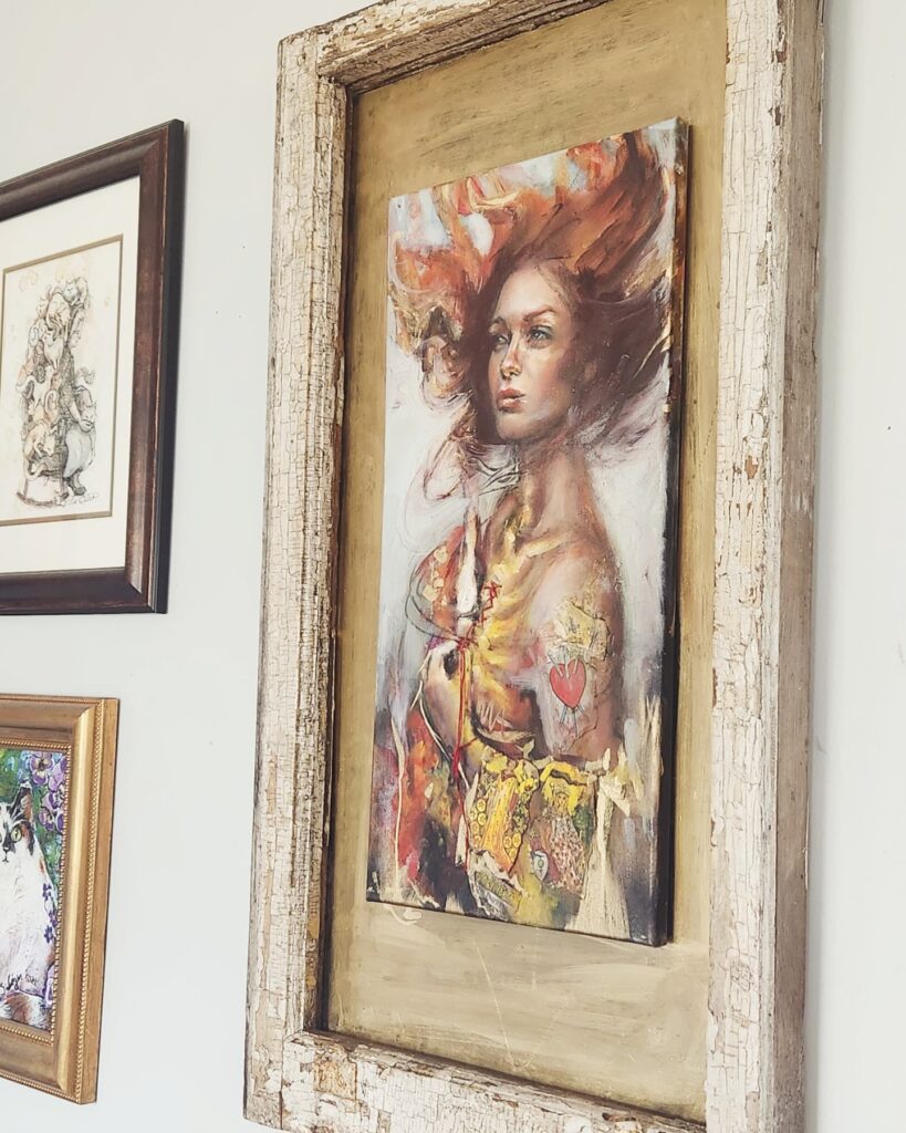 Figurative mixed-media painting of a woman with tarot card clothing, long red hair, holding a candle at her chest