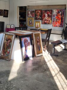 Several pieces of art by artists Sara leger on the studio floor in South Glengarry.